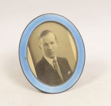 A George V silver and blue guilloche enamel mounted oval easel photograph frame, Goldsmiths &