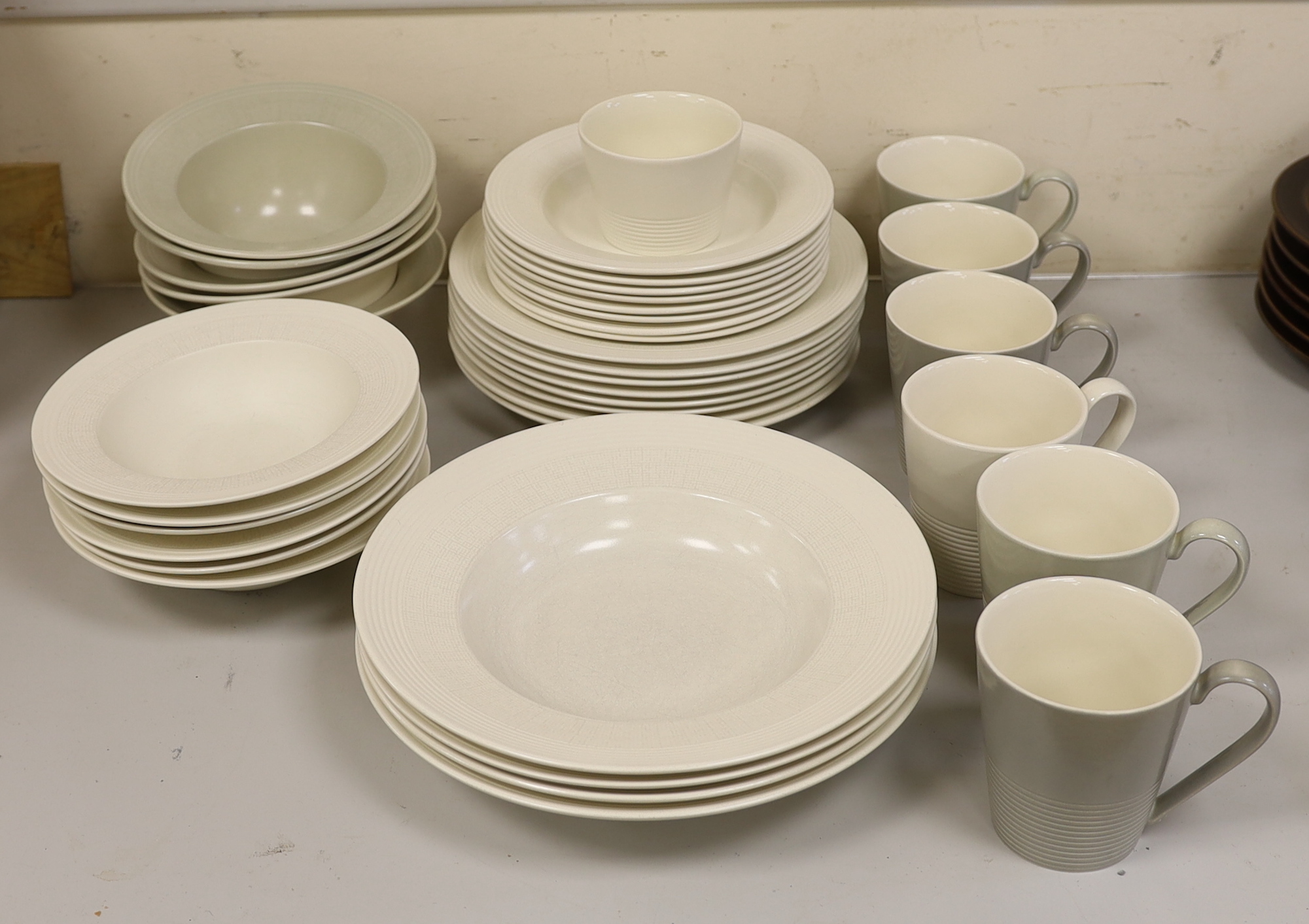 Paul Costelloe for Wedgwood, a part dinner set including six mugs, six bowls and eight dinner