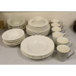 Paul Costelloe for Wedgwood, a part dinner set including six mugs, six bowls and eight dinner