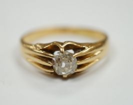 An 18ct gold and claw set solitaire diamond ring, size L, gross weight 3.5 grams.