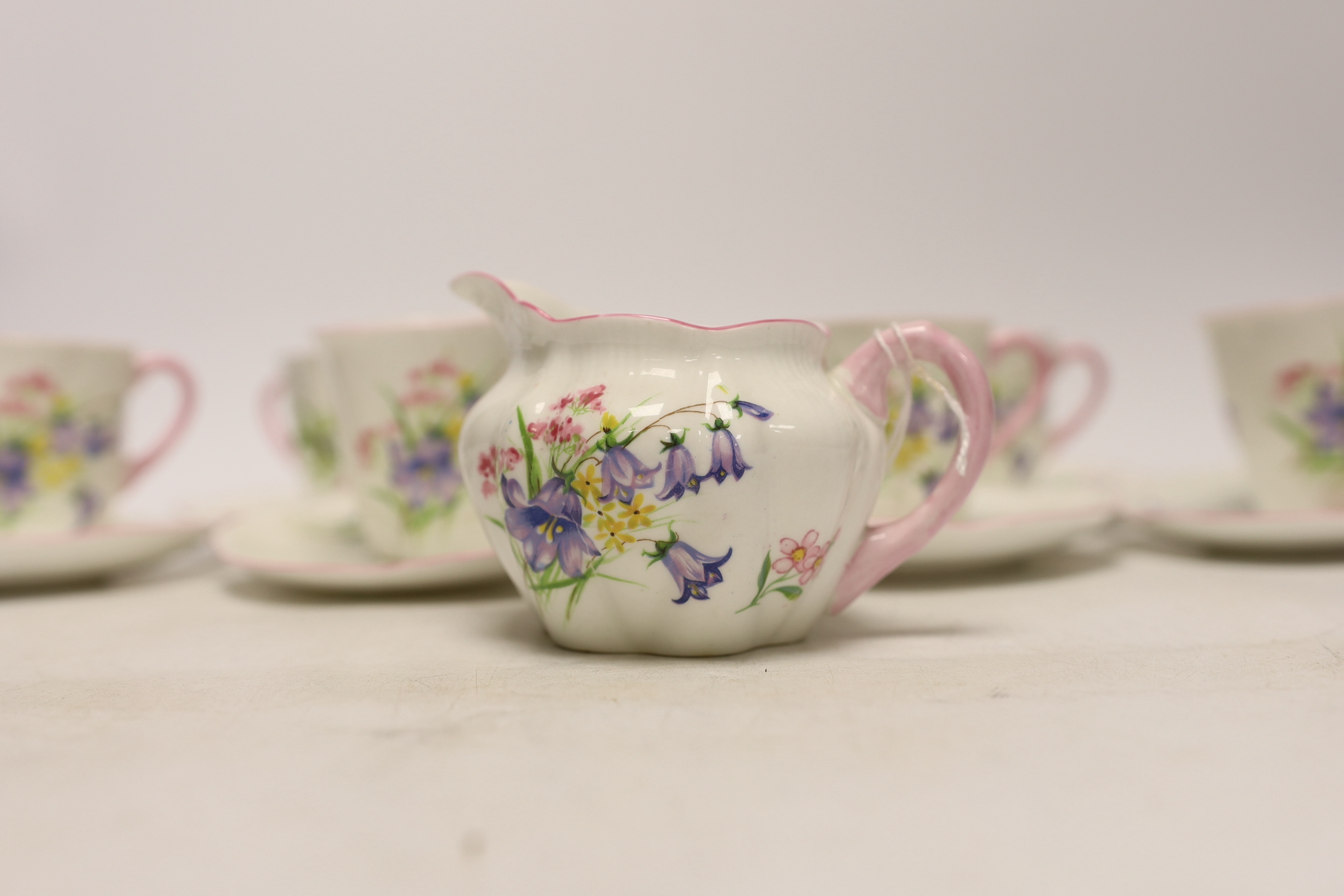 A Shelley 'wild flowers' bone china part tea set comprising milk jug and six cups and saucers - Image 4 of 5