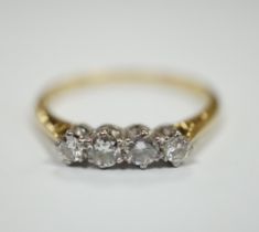 An 18ct, plat and four stone diamond set half hoop ring, size S, gross weight 2.8 grams.