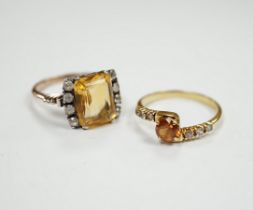 Two yellow metal citrine and simulated diamond set rings, gross weight 7.4 grams.