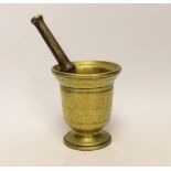 An antique bronze pestle and mortar, 15cm high