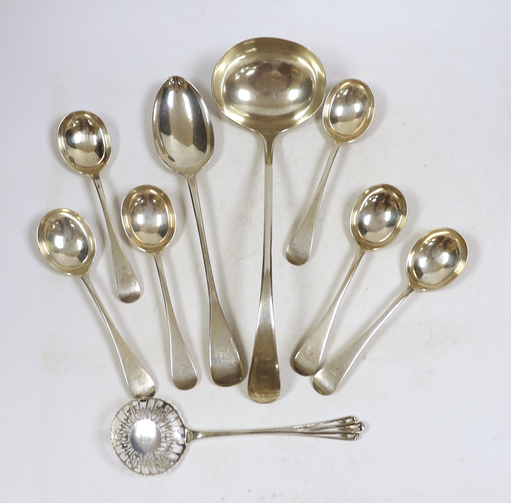 A George V silver Old English pattern soup ladle, basting spoon and set of six soup spoons, John