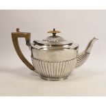 An Edwardian demi-fluted silver oval teapot, by Charles Stuart Harris, London, 1901, gross 16.5oz.