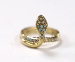 A modern 9ct gold and white opal cluster set serpent ring, size M, gross weight 3.7 grams.