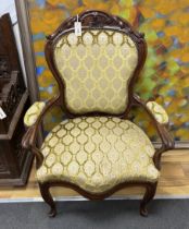A mid 19th century Dutch mahogany upholstered open armchair, width 75cm, depth 54cm, height 105cm