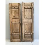 A pair of 19th century Continental fruitwood doors, with iron studwork decoration, each door width