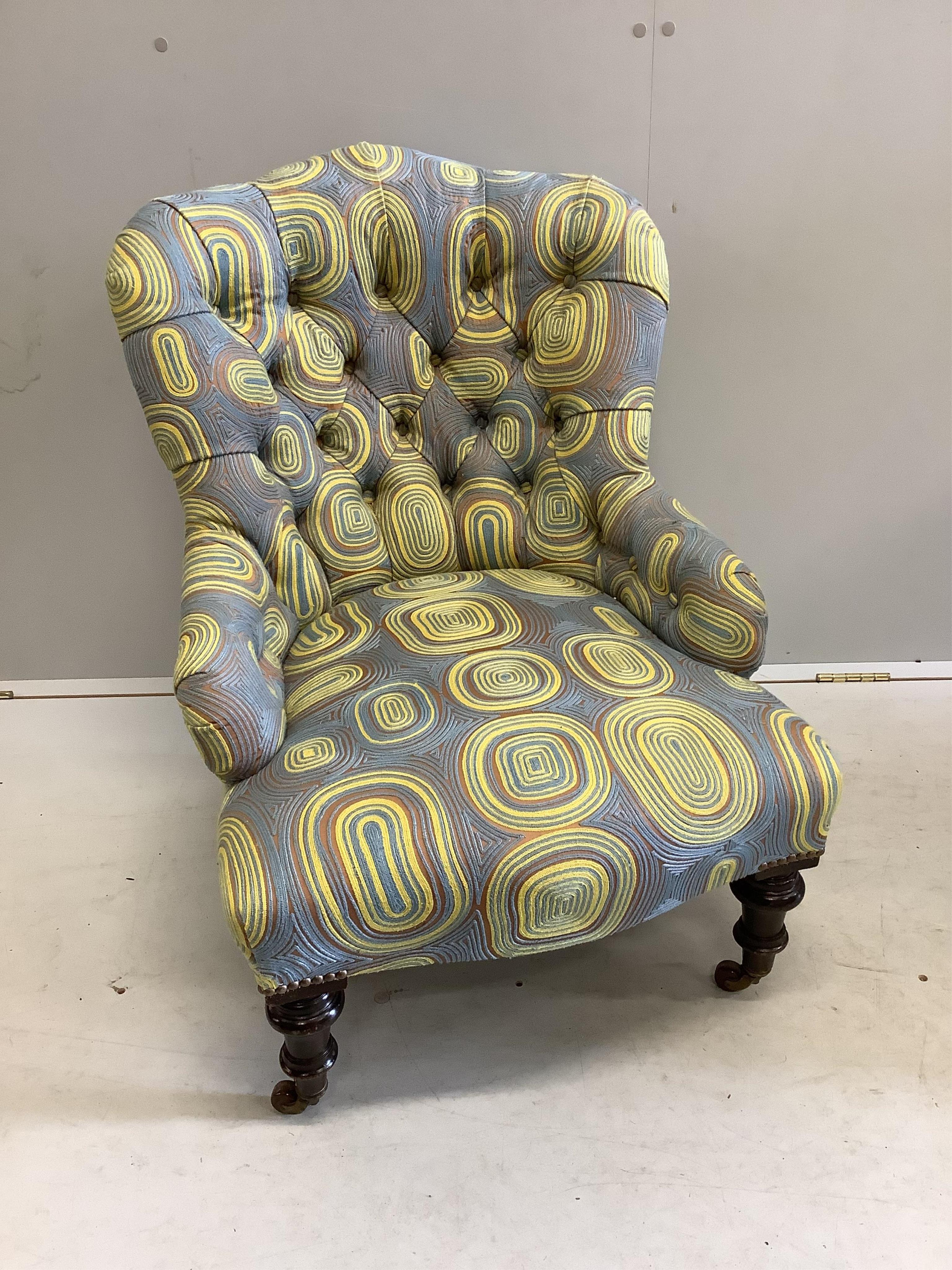 A late Victorian nursing chair, recently re-upholstered in a contemporary retro-style fabric,