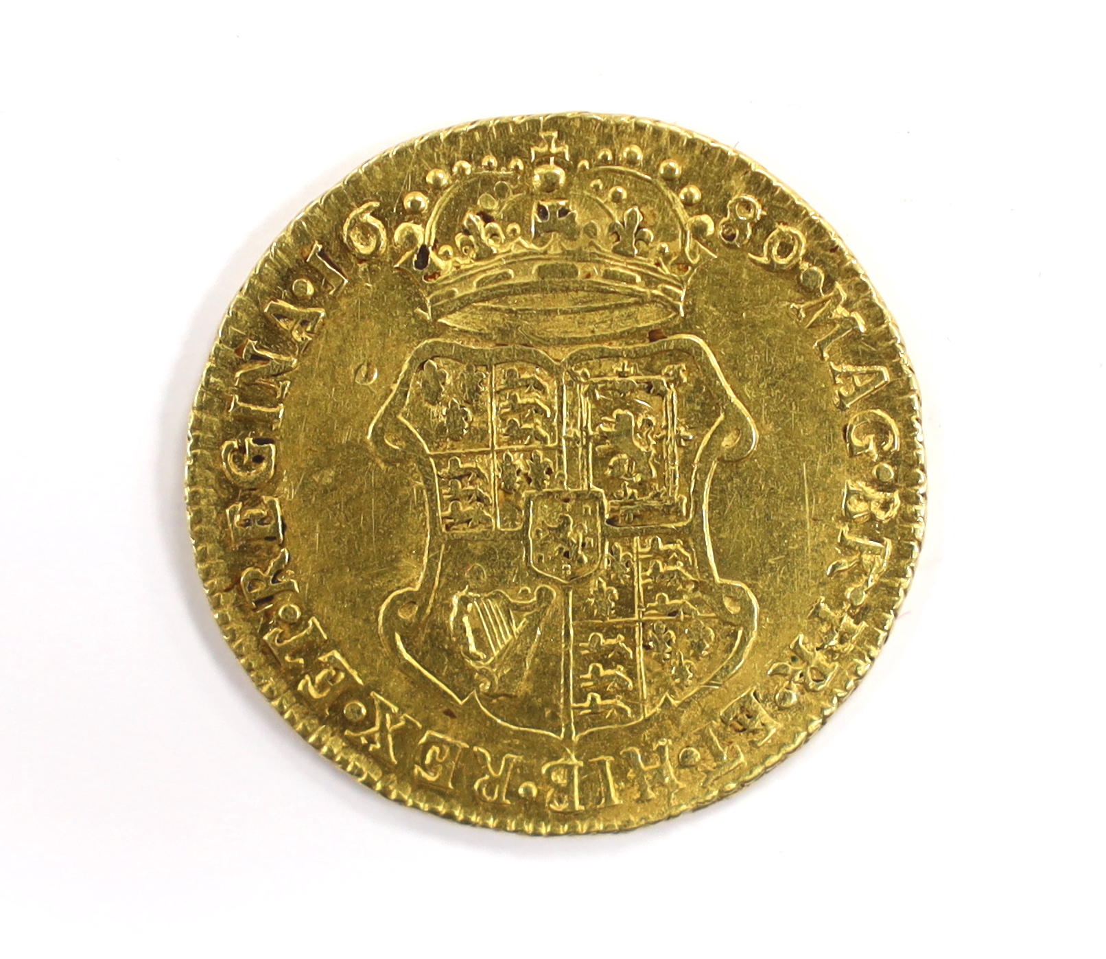 British gold coins - A William and Mary gold guinea, 1689, probably demounted at 12 o’clock, - Image 2 of 4