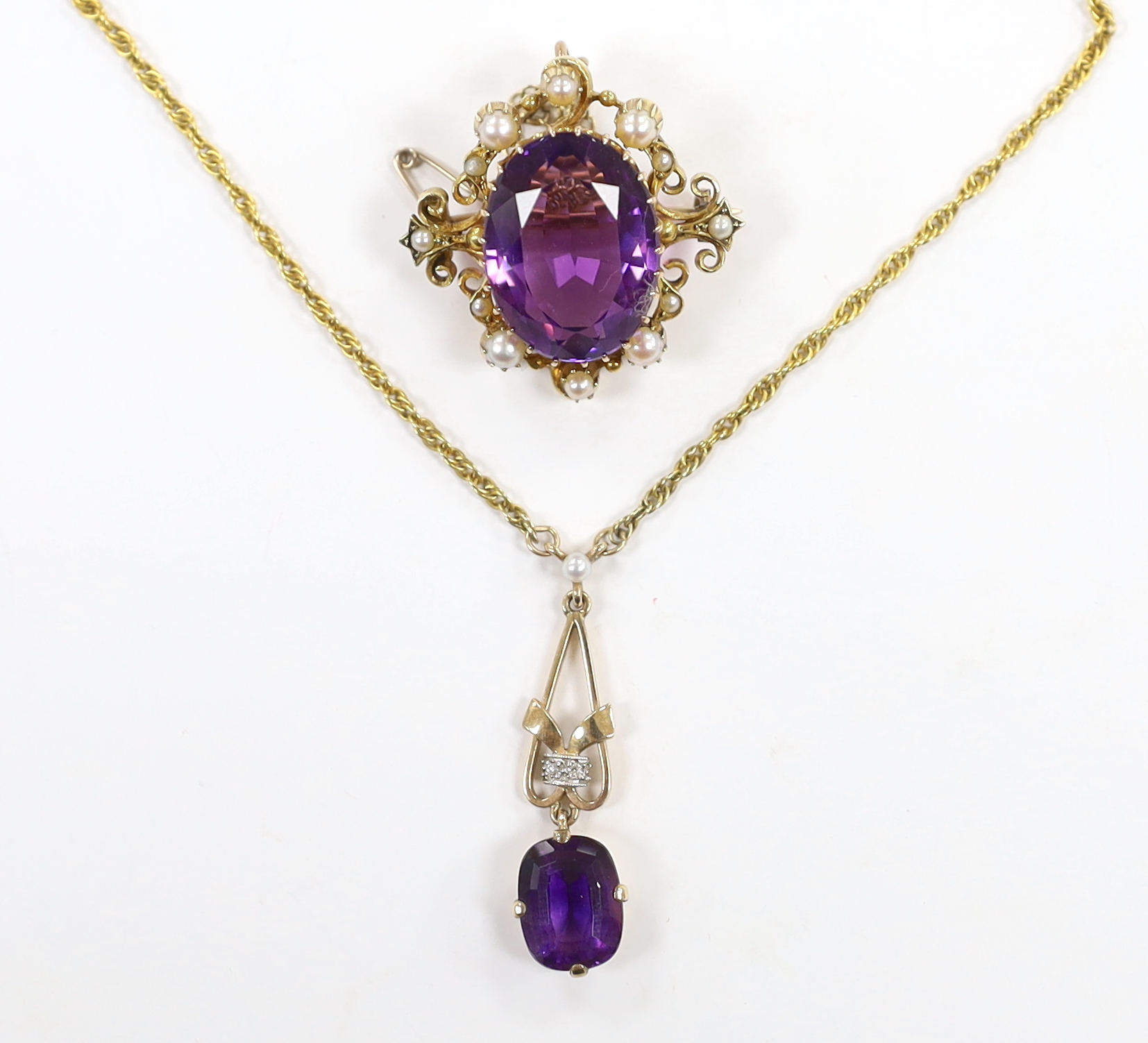 A 1960's 9ct gold, amethyst, seed pearl and diamond chip set drop pendant, 35mm, on a 9ct gold