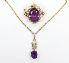 A 1960's 9ct gold, amethyst, seed pearl and diamond chip set drop pendant, 35mm, on a 9ct gold