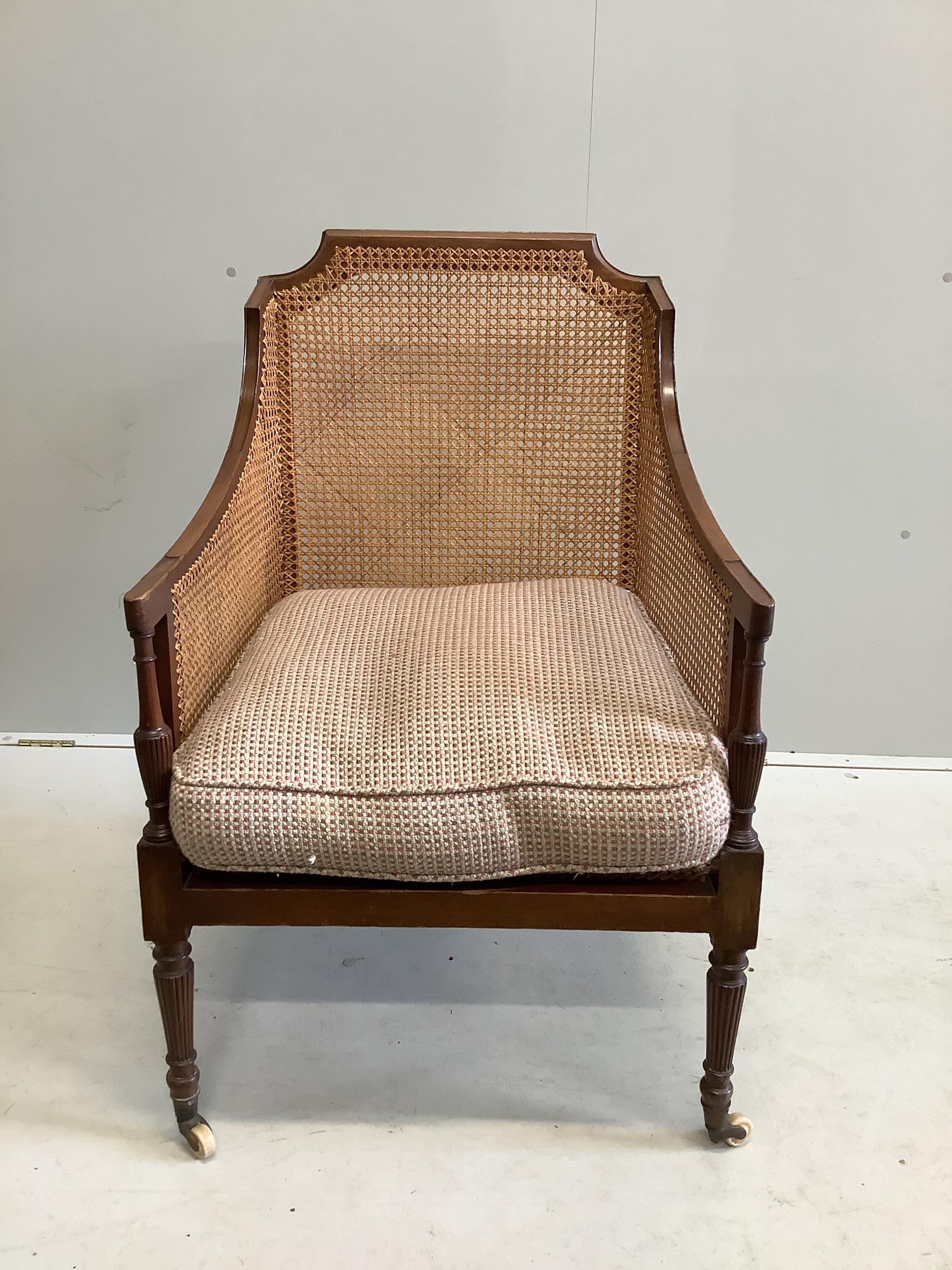 A Regency style mahogany Bergere armchair, width 65cm, depth 72cm, height 96cm