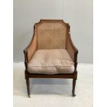 A Regency style mahogany Bergere armchair, width 65cm, depth 72cm, height 96cm
