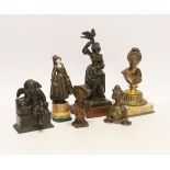 Two bronze figures, one bone mounted, three bronze busts and a patinated spelter figure of Cupid,