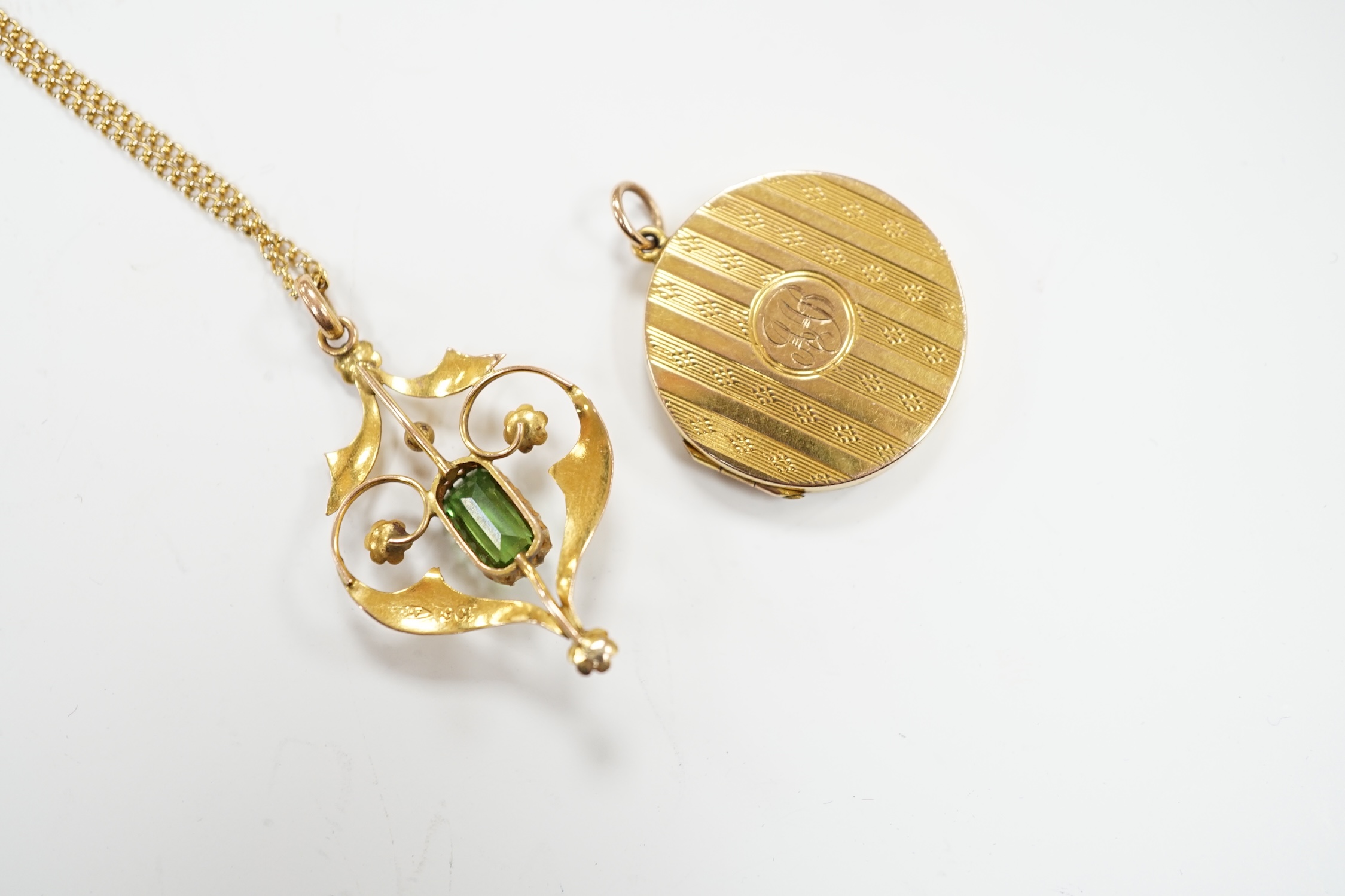 An Edwardian Art Nouveau 9ct, green tourmaline? and seed pearl set pendant, 37mm, on a gilt metal - Image 3 of 3