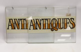 A pair of reverse painted glass 'antique' signs, 28 x 38cm