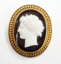 A Victorian yellow metal mounted cameo agate oval brooch, carved with head of a classical goddess to
