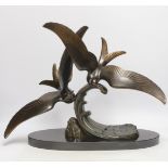 An Art Deco patinated spelter seagull group, signed Trebig, raised on slate base, 48cm wide