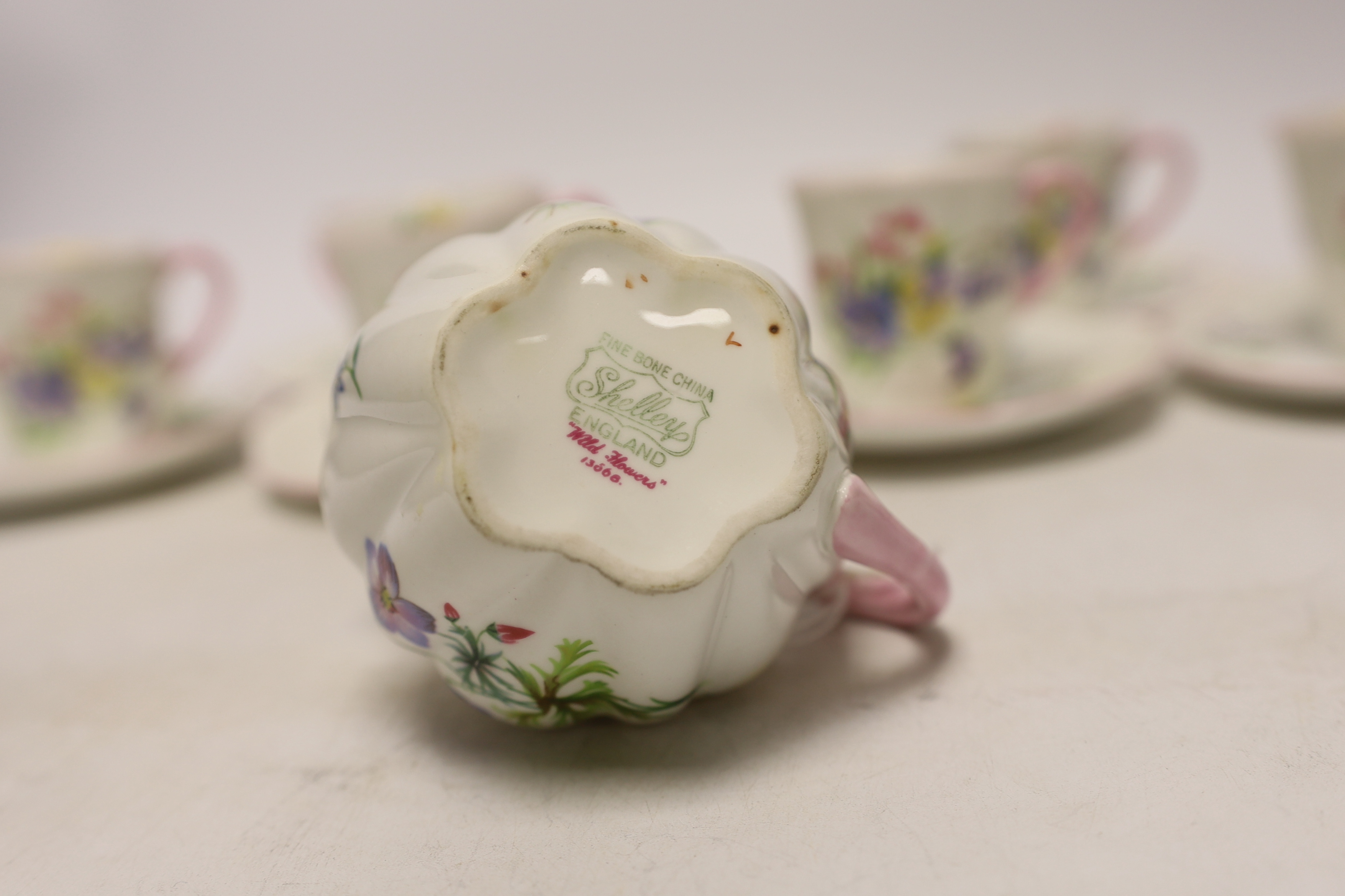 A Shelley 'wild flowers' bone china part tea set comprising milk jug and six cups and saucers - Image 5 of 5