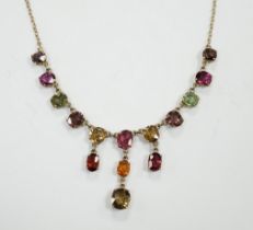 A yellow metal and multi gem set drop necklace, set with oval cut stones including tourmaline and