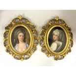 A pair of Continental oval porcelain plaques hand painted with female portraits, housed in