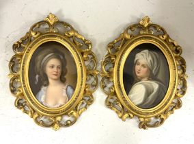 A pair of Continental oval porcelain plaques hand painted with female portraits, housed in