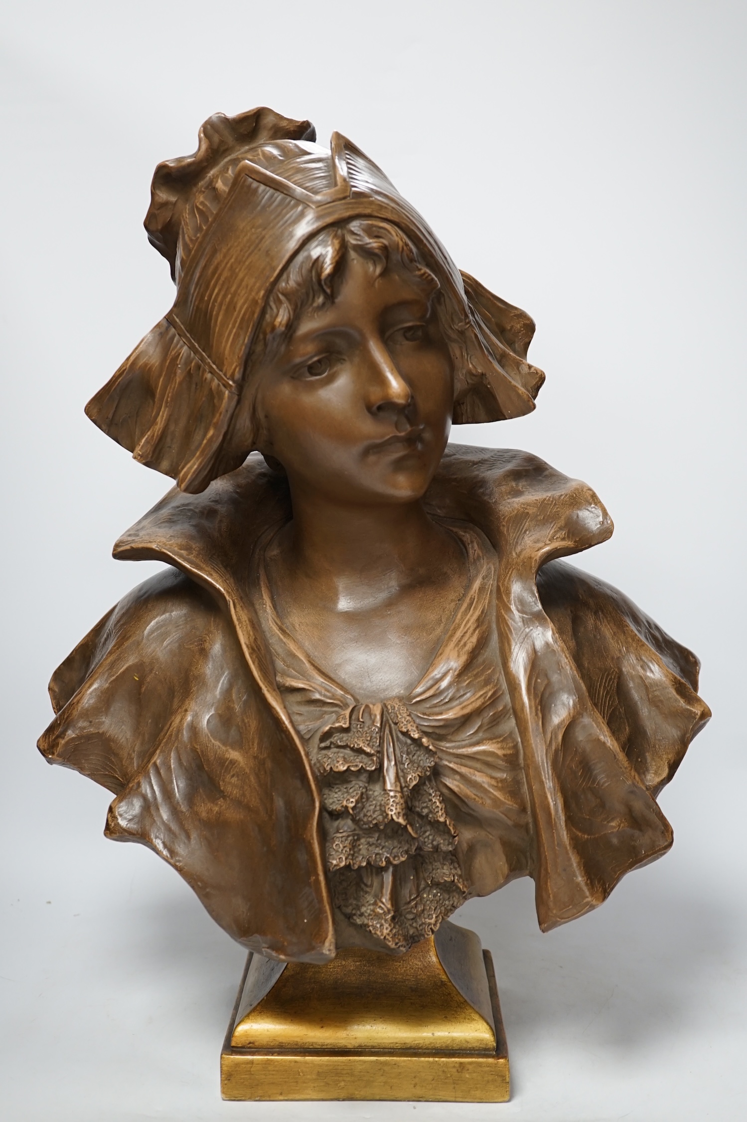 A large bronzed terracotta bust of a Dutch girl, early 20th century, 55cm high