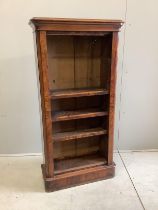 A Victorian figured walnut narrow open bookcase, width 65cm, depth 27cm, height 132cm