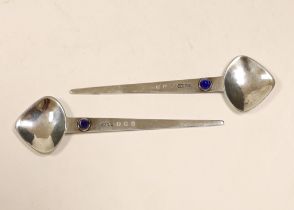 A pair of Elizabeth II Arts & Crafts Scottish silver and single stone cabochon lapis lazuli set