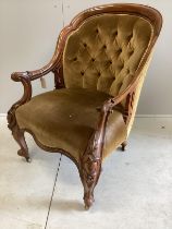 A Victorian walnut framed upholstered open armchair, width 68cm, depth 70cm, height 90cm