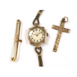 A lady's yellow metal manual wind wrist watch, the dial inscribed 'Rolex', a 9ct gold cross