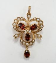 A modern 9ct gold garnet and seed pearl cluster set drop pendant brooch, 39mm, gross weight 4.8