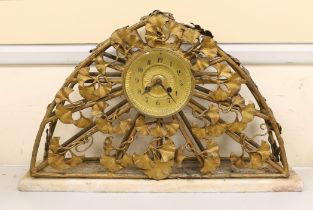 An Art Nouveau gilt metal mantel clock, 51cm wide, 33cm high