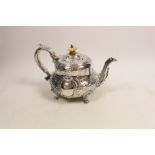 An early Victorian embossed silver teapot, Robert Hennell III, London, 1843, gross weight 22.2oz.