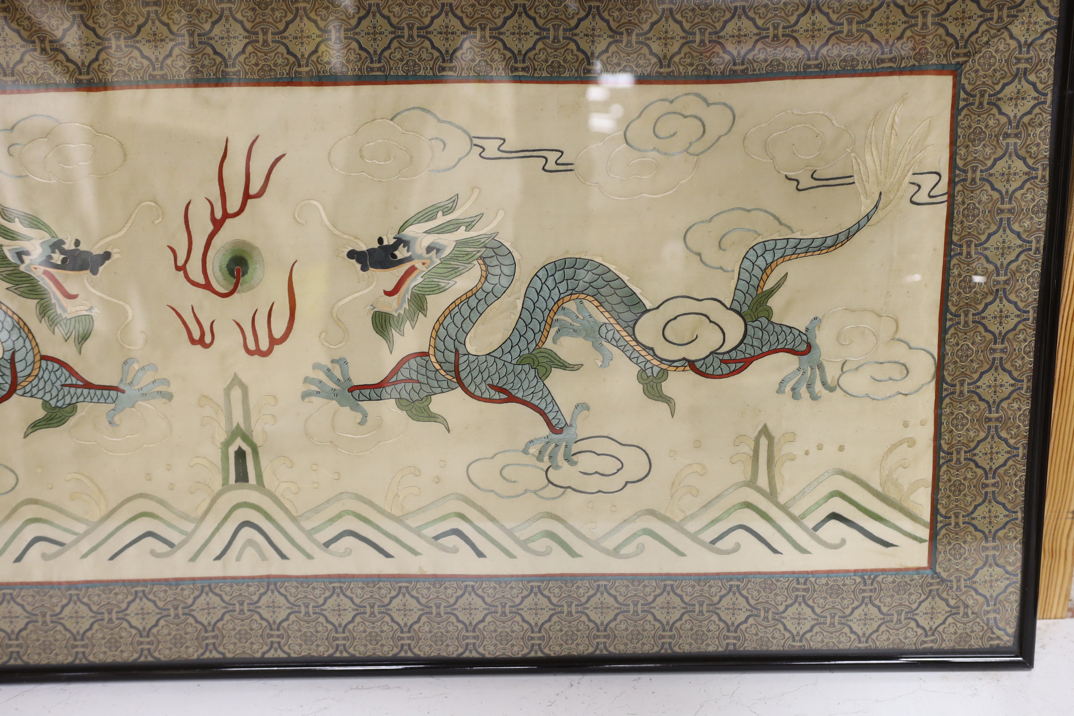 A framed 20th century Chinese silk embroidered 'dragon’ panel, with flaming pearl design, bordered - Image 3 of 3