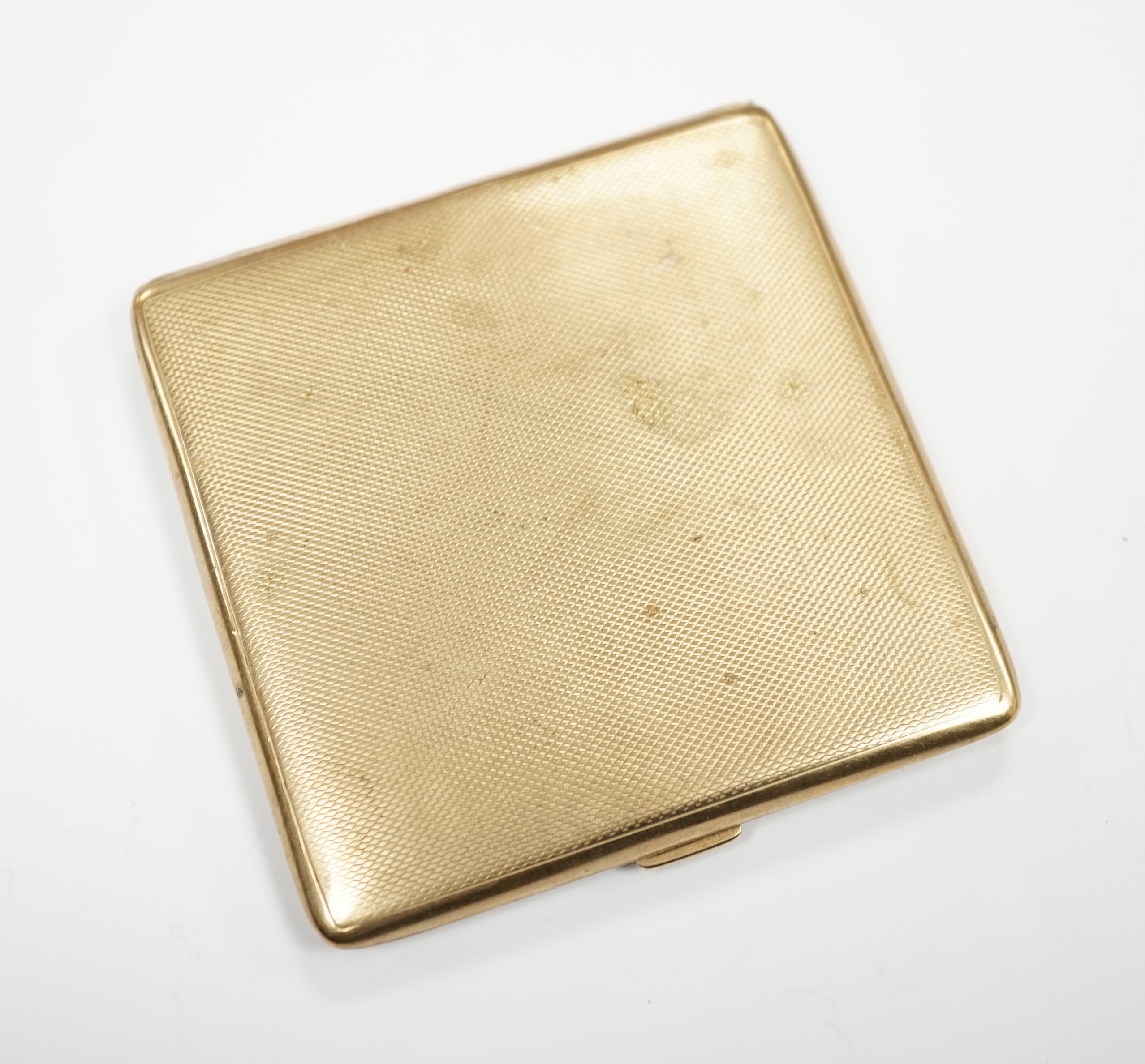 A George V square engine turned 9ct gold cigarette case by S. Blanckensee & Sons Ltd., Birmingham,