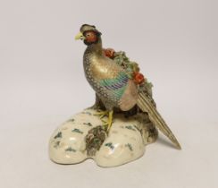 A Japanese Satsuma model of a pheasant, late 19th century, signed to the base, 21cm high