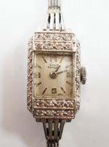 A lady's Girard Perregaux white metal and diamond cluster set manual wind cocktail watch, on a 9ct