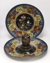 Two Japanese cloisonné enamel chargers and a finer cloisonne jar and cover on stand, largest 46cm (