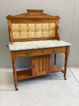 A late Victorian satin walnut tiled back marble top washstand, width 106cm, depth 52cm, height