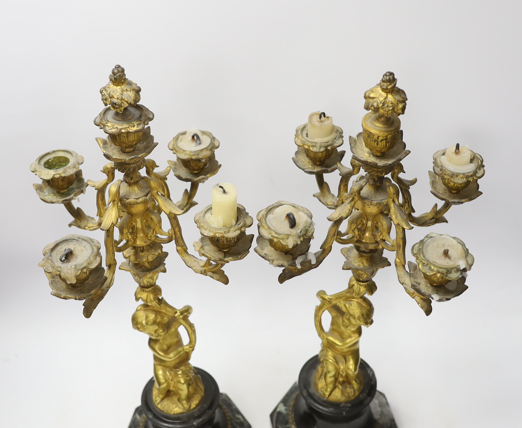 A pair of late 19th century French ormolu cherubic four branch candelabra on marble bases, 47cm - Image 3 of 4