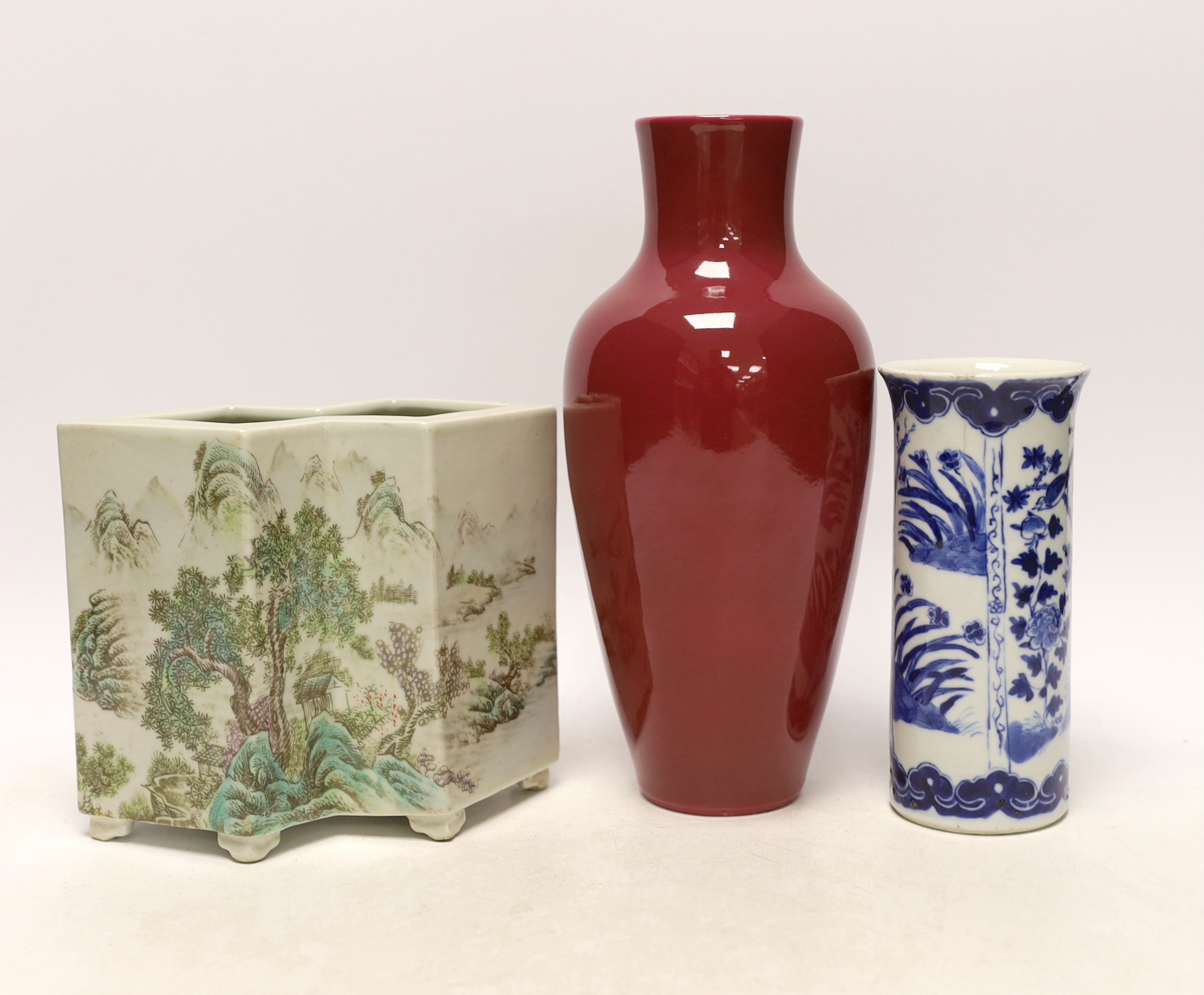 An early 20th century Chinese blue and white cylindrical vase, a ruby ground vase and an enamelled