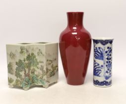 An early 20th century Chinese blue and white cylindrical vase, a ruby ground vase and an enamelled