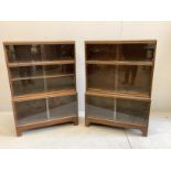 A pair of Minty glazed oak three section bookcases, width 89cm, depth 29cm, height 129cm