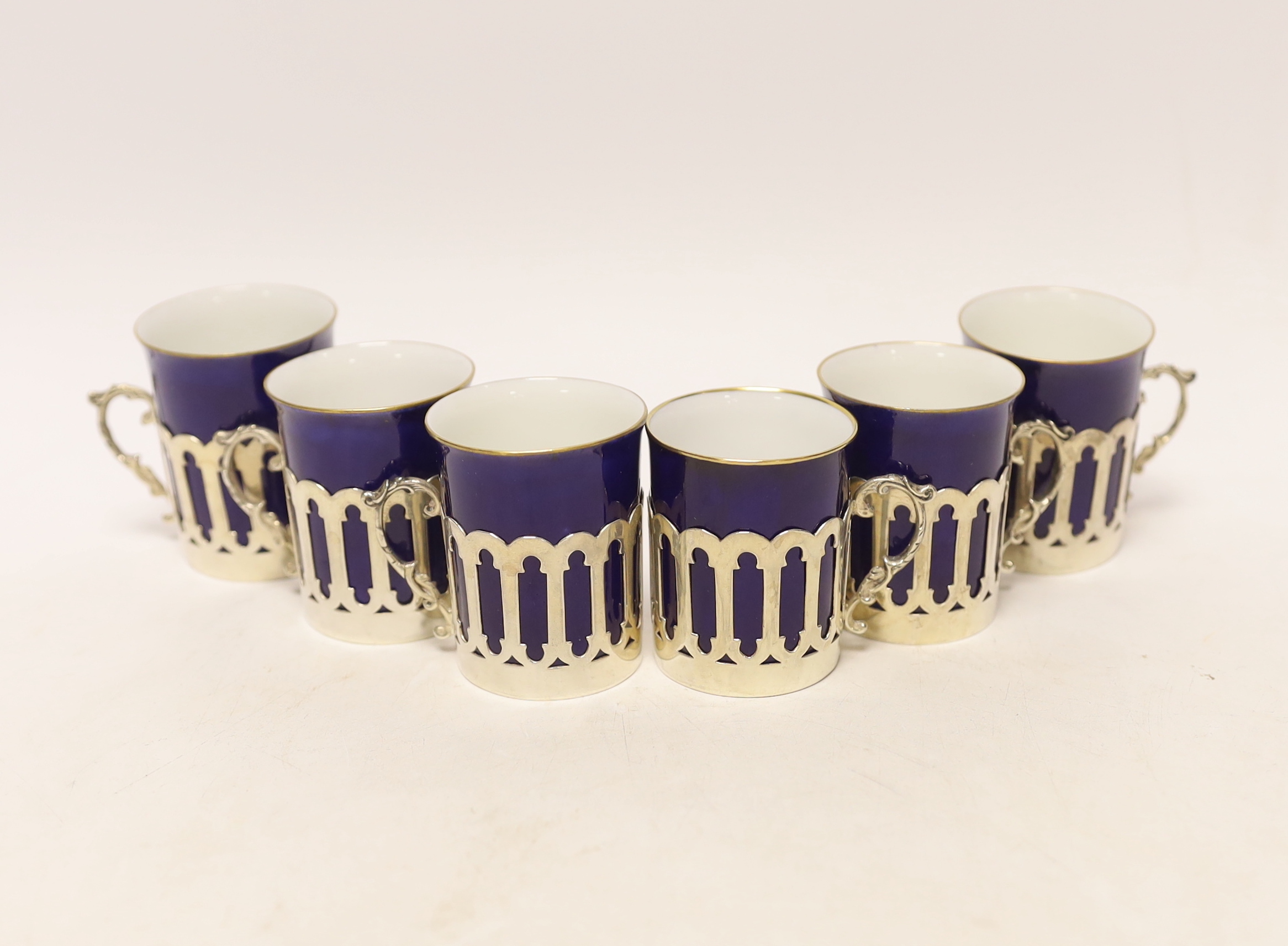 A set of six pierced silver handled coffee can holders, James Dixon & Sons, Sheffield, 1911, with