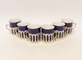 A set of six pierced silver handled coffee can holders, James Dixon & Sons, Sheffield, 1911, with