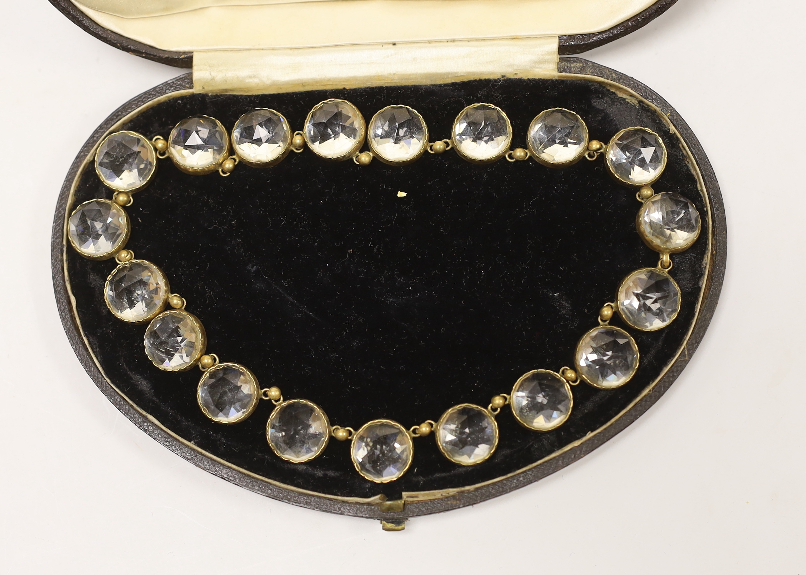 An antique gilt metal and paste set necklace, 44cm.