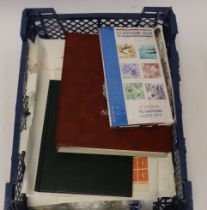 Two stamp albums and various loose pages and bags of loose stamps